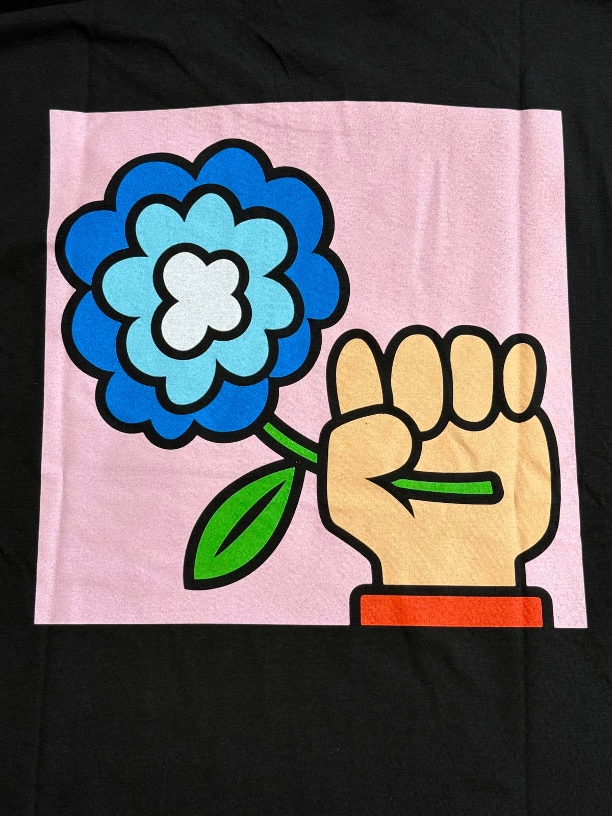 T-shirt du groupe Idles avec poing et fleur au dos